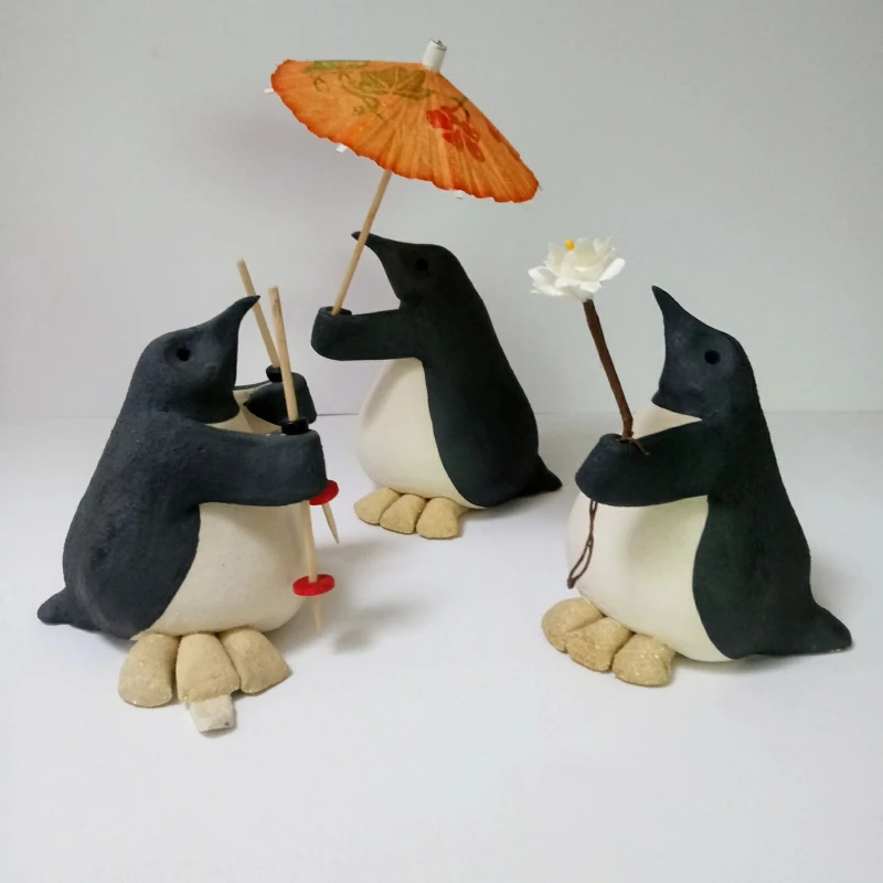 Collection of small ceramic penguins