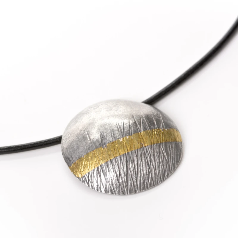 Textured oxidised recycled silver, with a 24 carat gold stripe